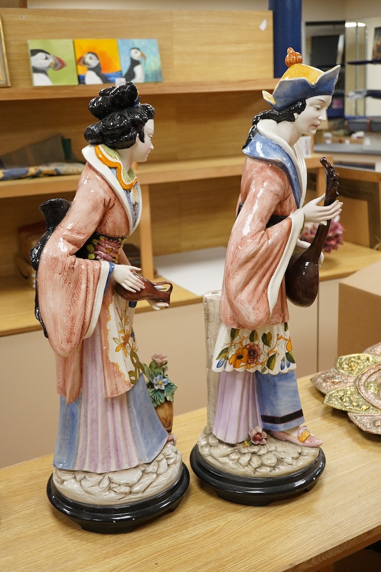 D. Polo Uiato, a pair of large ceramic figurines, Geisha girls, signed, 86cm high